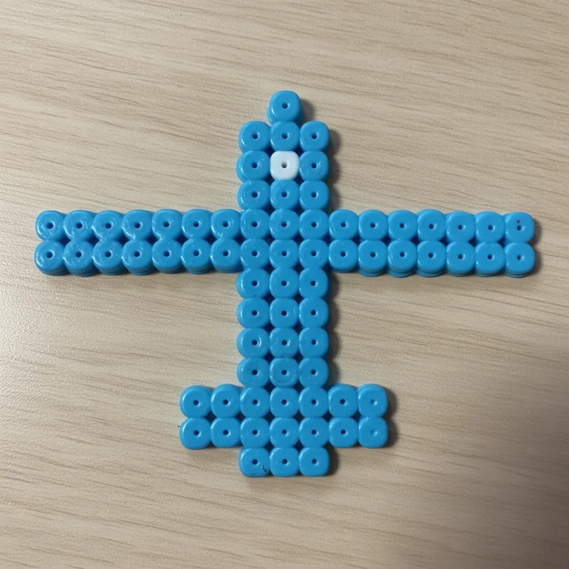 Airplane beaded in fuse beads, 29x29 pegs