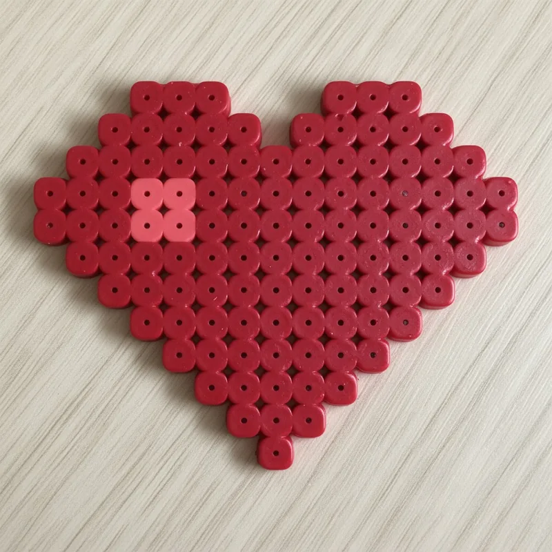 Heart beaded in fuse beads, 29x29 pegs