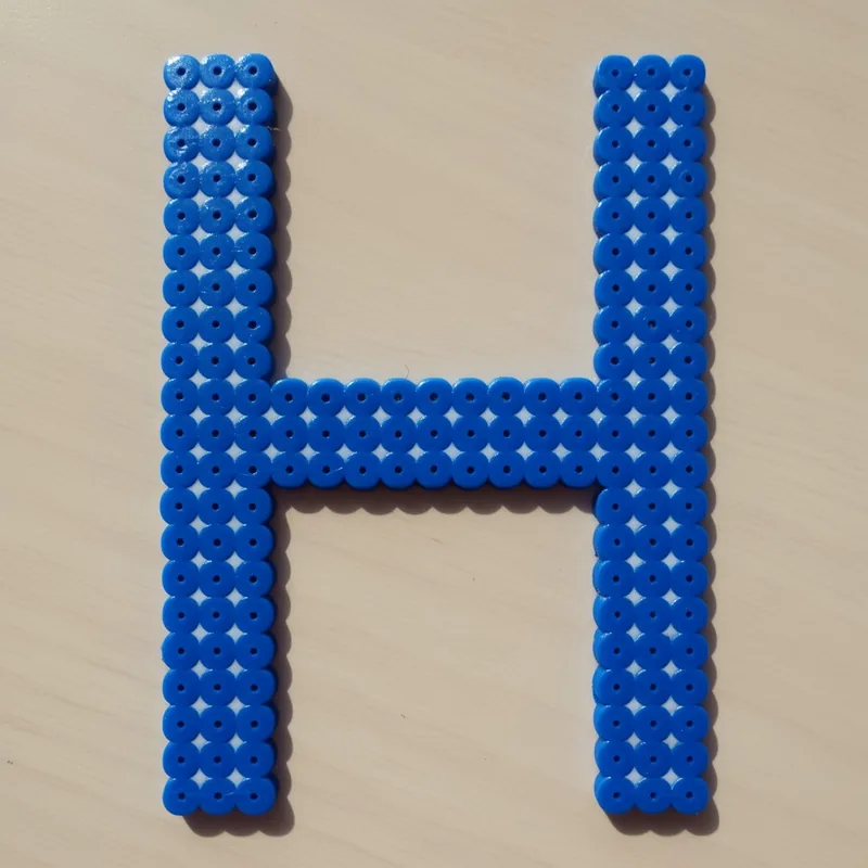 Letter H beaded in fuse beads, 29x29 pegs