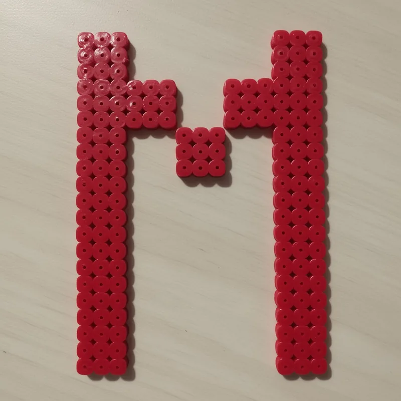 Letter M beaded in fuse beads, 29x29 pegs