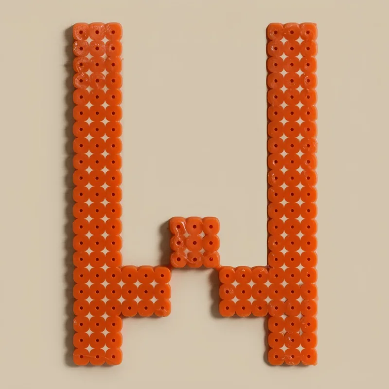 Letter W beaded in fuse beads, 29x29 pegs