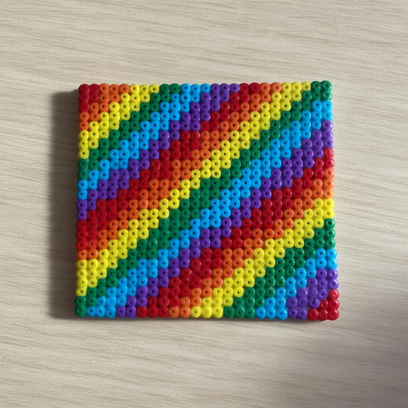 Rainbow stripes beaded in fuse beads, 29x29 pegs
