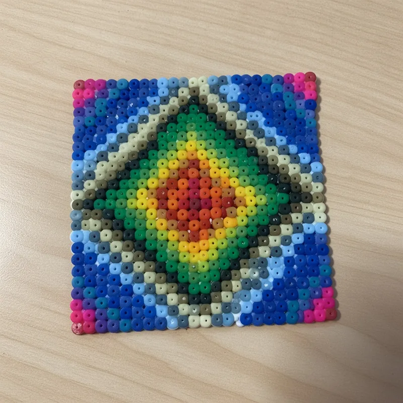 Rainbow rings beaded in fuse beads, 29x29 pegs