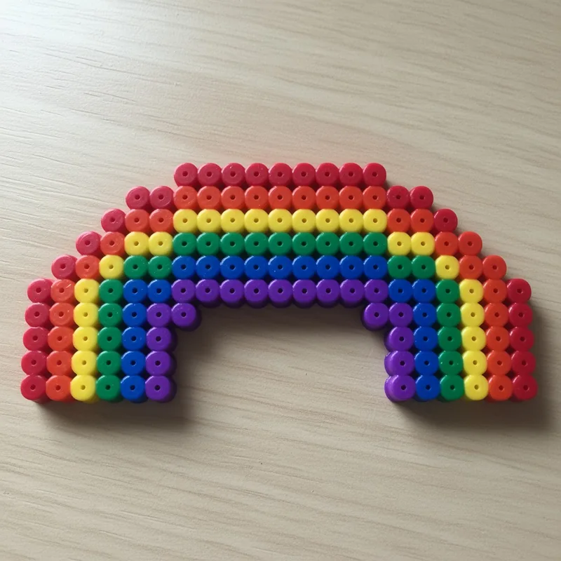 Rainbow beaded in fuse beads, 29x29 pegs