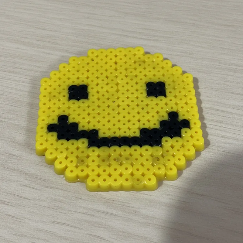 Smiley face beaded in fuse beads, 29x29 pegs