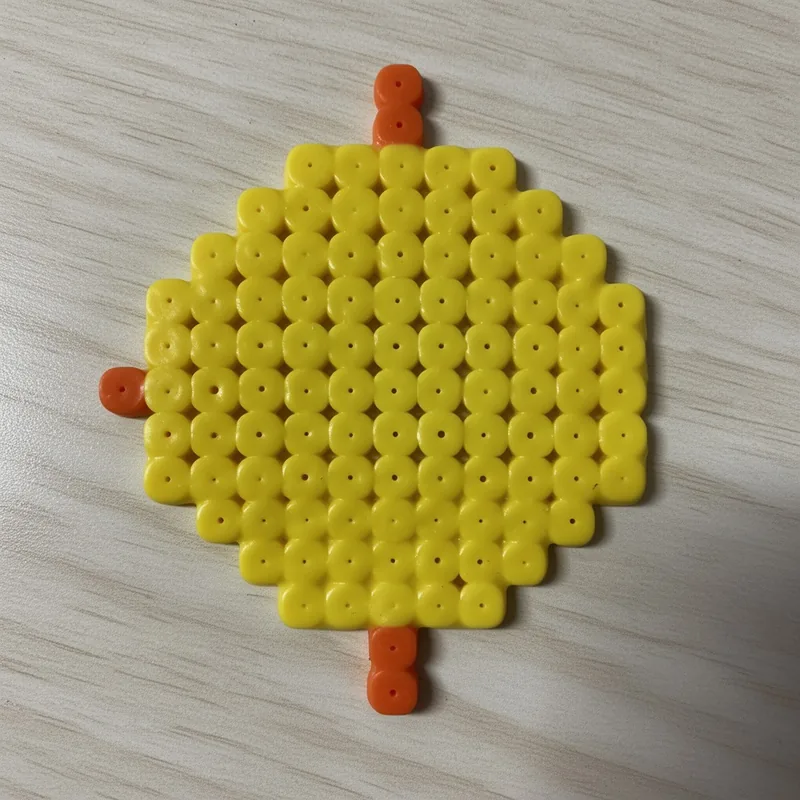Sun beaded in fuse beads, 29x29 pegs